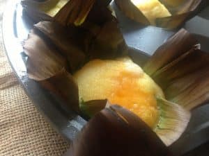 Bibingkang Galapong- Filipino Rice Cakes with Butter and Cheese in Banana Leaves
